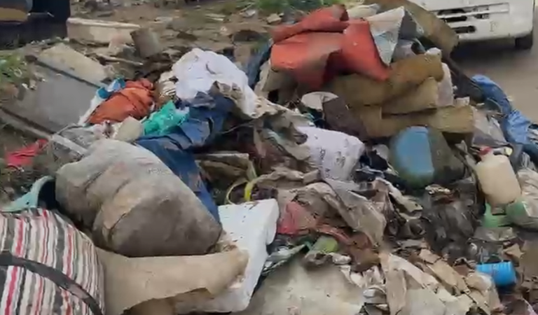 Flood waste piles up in Alajo, raising health fears
